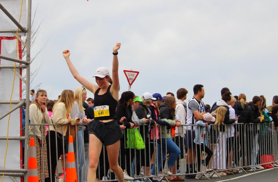 Celebrating completing the half-marathon on Sunday is Julia Gwynne Jones.
