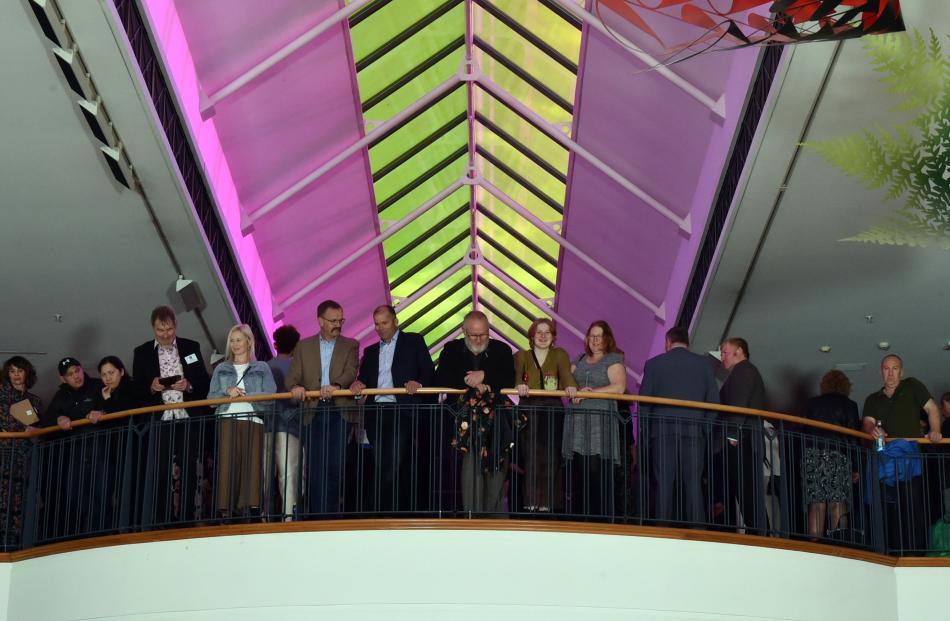 Guests at the Class Act ceremony watch on as the recipients pose for a photo at the Dunedin...