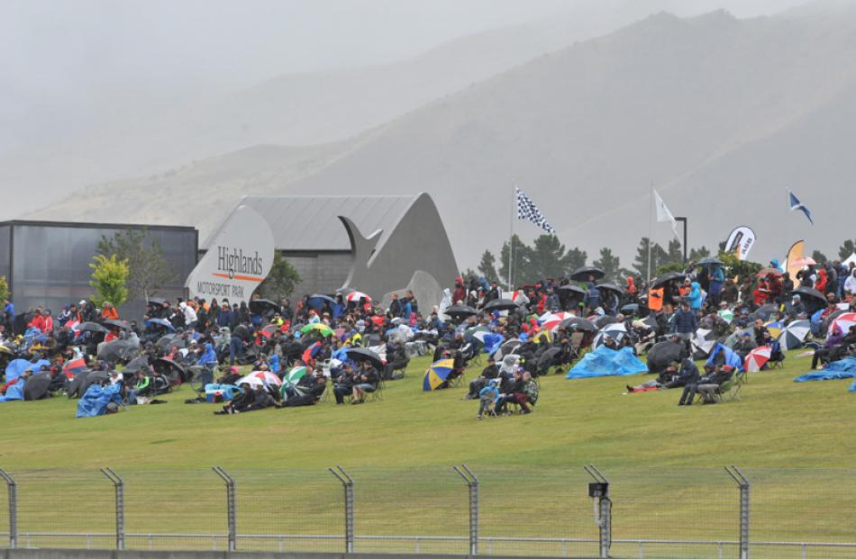 Jackets and umbrellas were the order of the day for spectators.