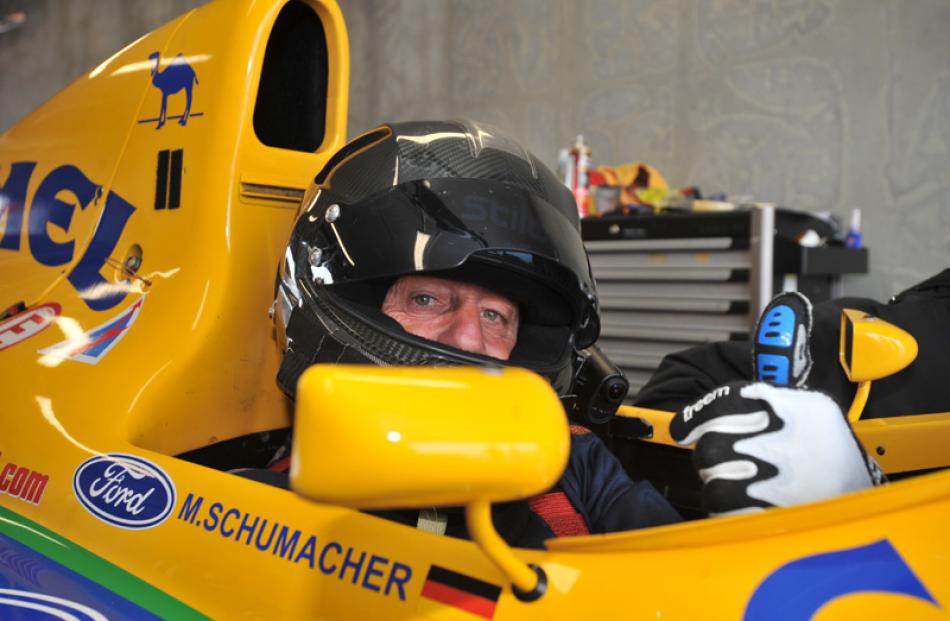 Track owner Tony Quinn prepares for a couple of laps in Michael Schumacher's F1.