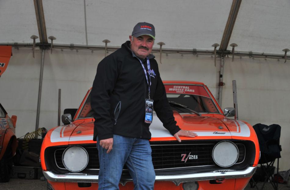 Steve Scoles, of Dunedin, with his muscle car.