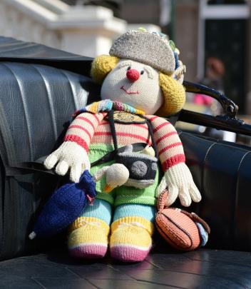 A knitted doll goes along for a ride in a 915 Ford Model T.