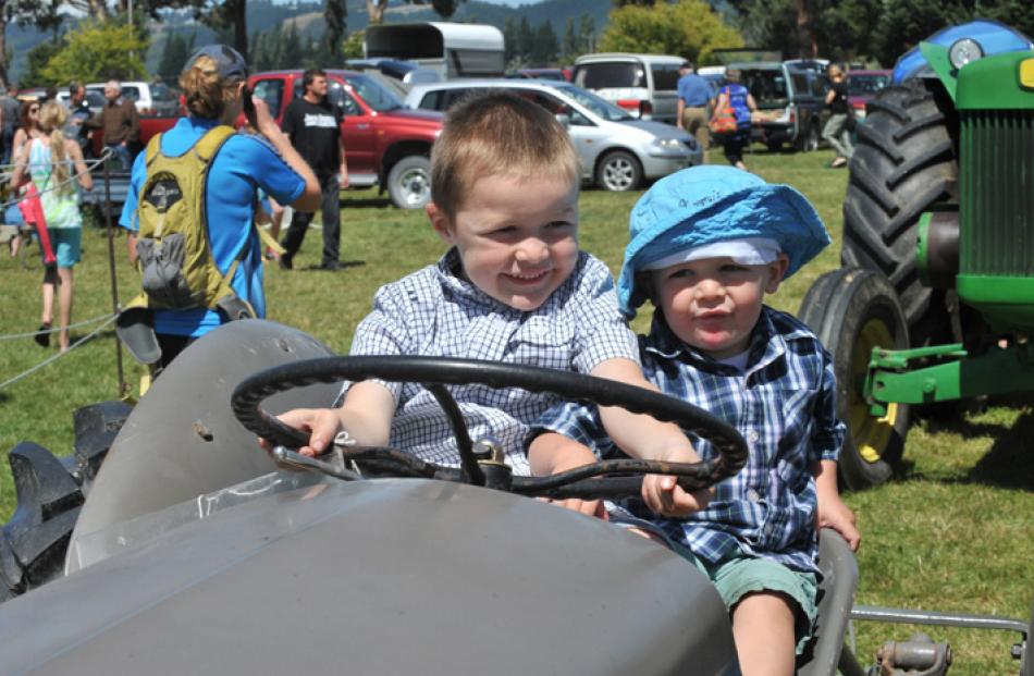 Joshua (5) and Benjamin (2) Geddes, of Middlemarch, try the driver's seat.