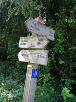A sign provides direction to walkers along the Chemin de St-Jacques pilgrim trail in France.