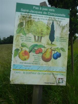 Signs along the Chemin de St-Jacques pilgrim trail in France inform walkers of fruit trees that...