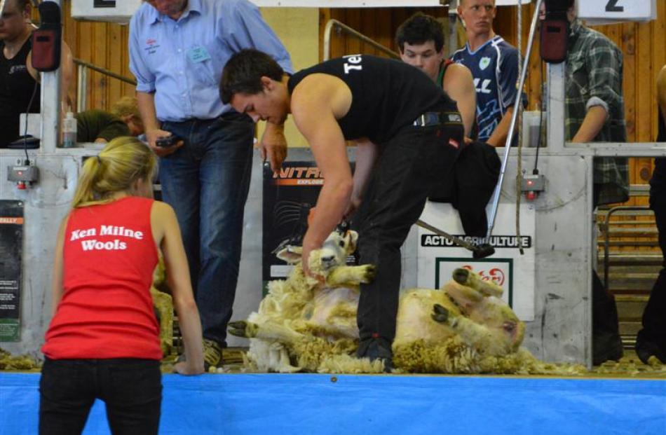 Judge Grant Bradfield keeps an eye on Dylan McGruddy, of Masterton, as he wins the Otago...