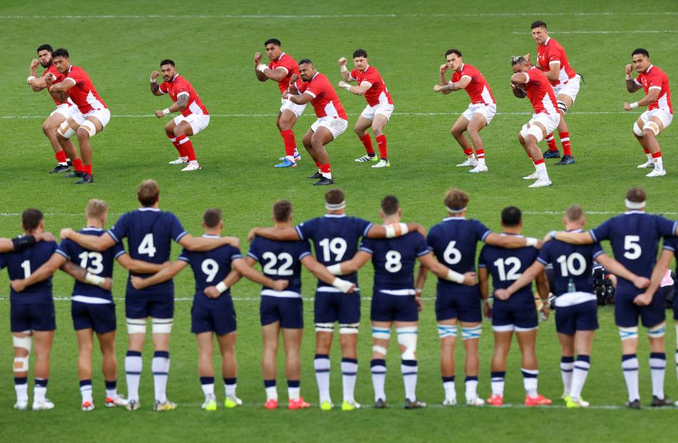 Tonga players perform the Sipi Tau before facing Scotland. PHOTO: REUTERS