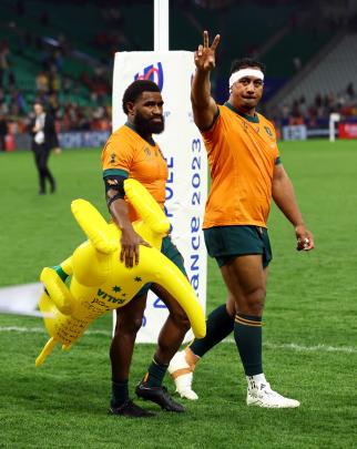 Australia's Marika Koroibete (left) and Pone Fa'amausili acknowledge the crowd after their team’s...