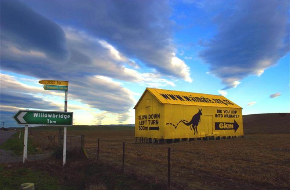 The landmark ''yellow shed'' at the turnoff to Waimate invites visitors to slow down and take a...
