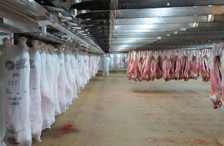 Lamb carcasses are prepared for export at Finegand, Balclutha.