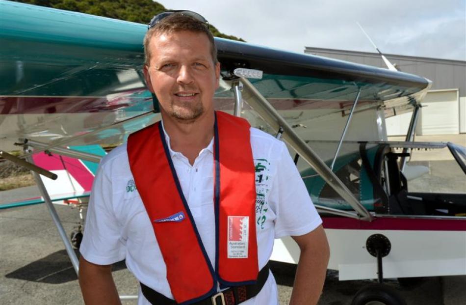 Craig Buist beside his amphibious aircraft.