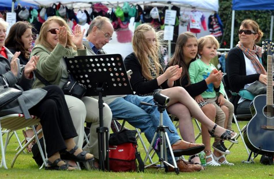 Members of the crowd watch the entertainers at Party in the Park in Mosgiel yesterday. Photos by...