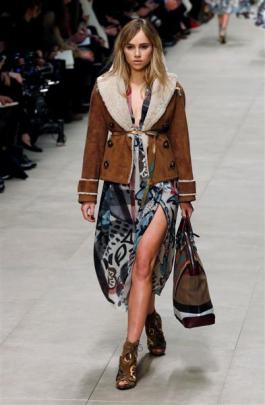 Model and actress Suki Waterhouse presents a creation from the Burberry Prorsum Autumn/Winter...