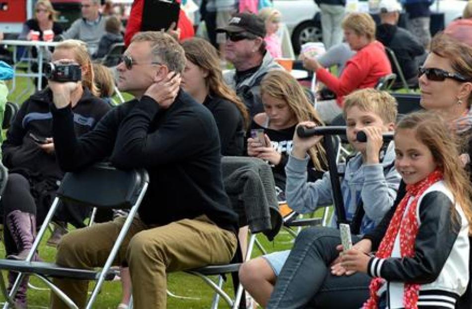 People  watch entertainers at Party in the Park in Mosgiel on Sunday.