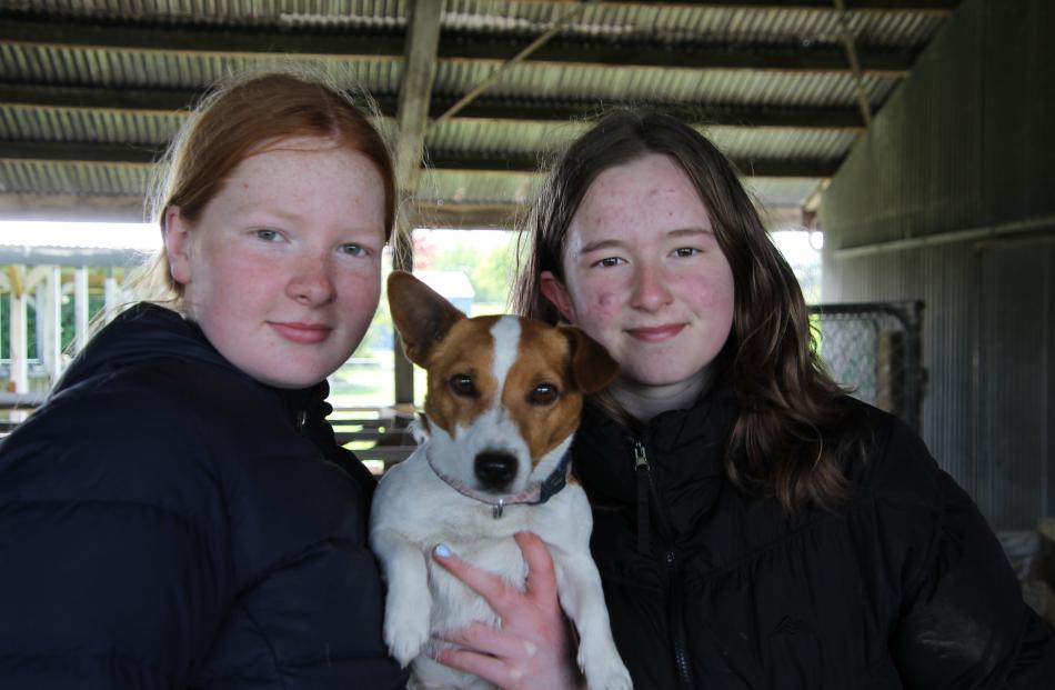 Sophie Jack, 13, and Holly Wilson, 12, holding Meg.