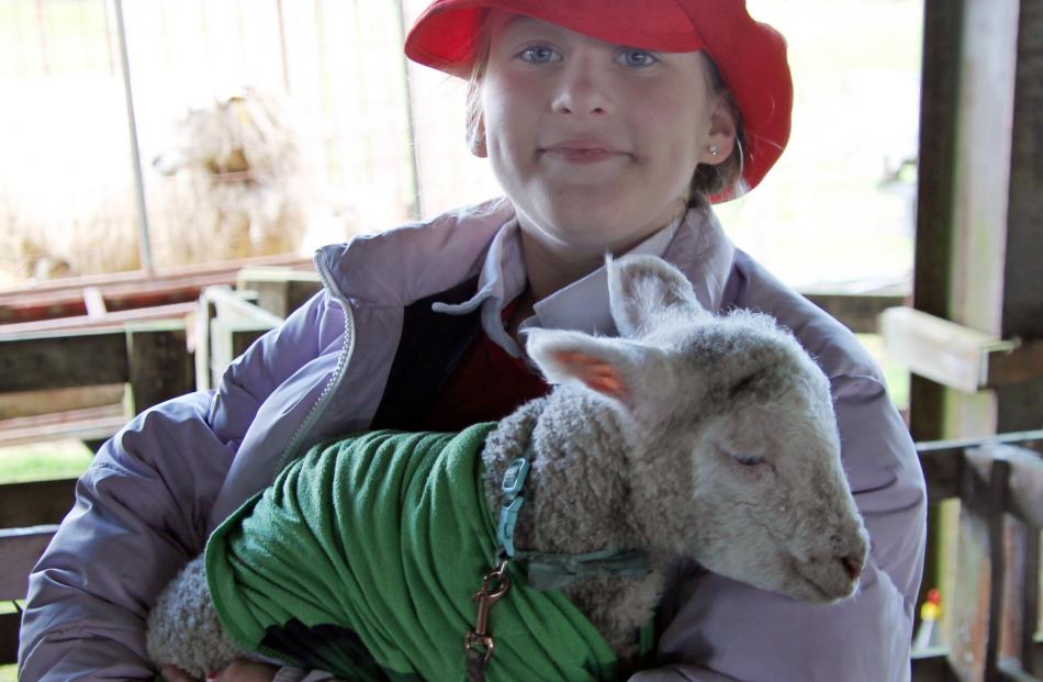 Georgie Cleverley, 10, with lamb Coconut.
