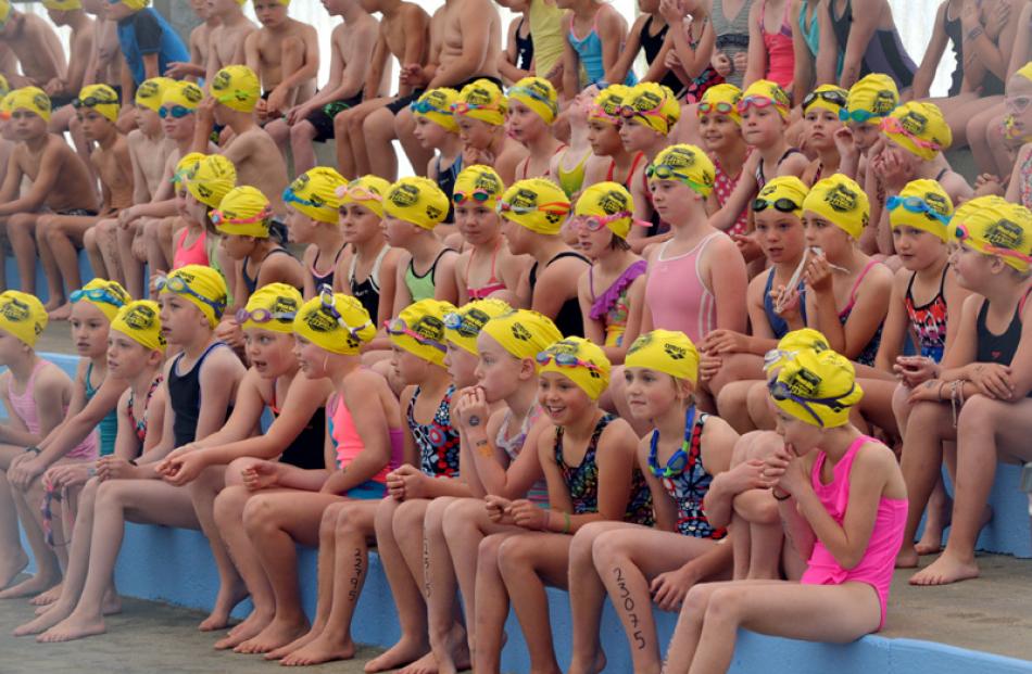 Swimmers await their turn.