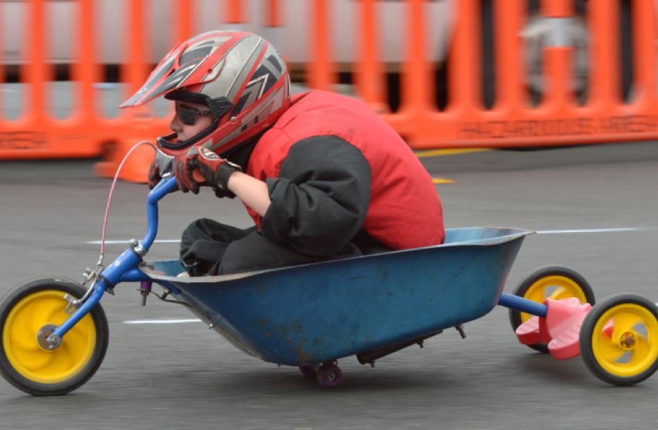 Jayden Rae (12) uses a modified wheelbarrow.