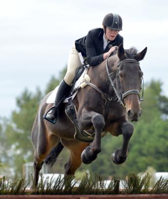 Tyla Clearwater of Dunedin with Horse Rumbling Thunder in a novice hack event.