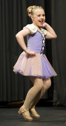 Penny Todd, 9, performs with enthusiasm in the open tap under-10 solo section.