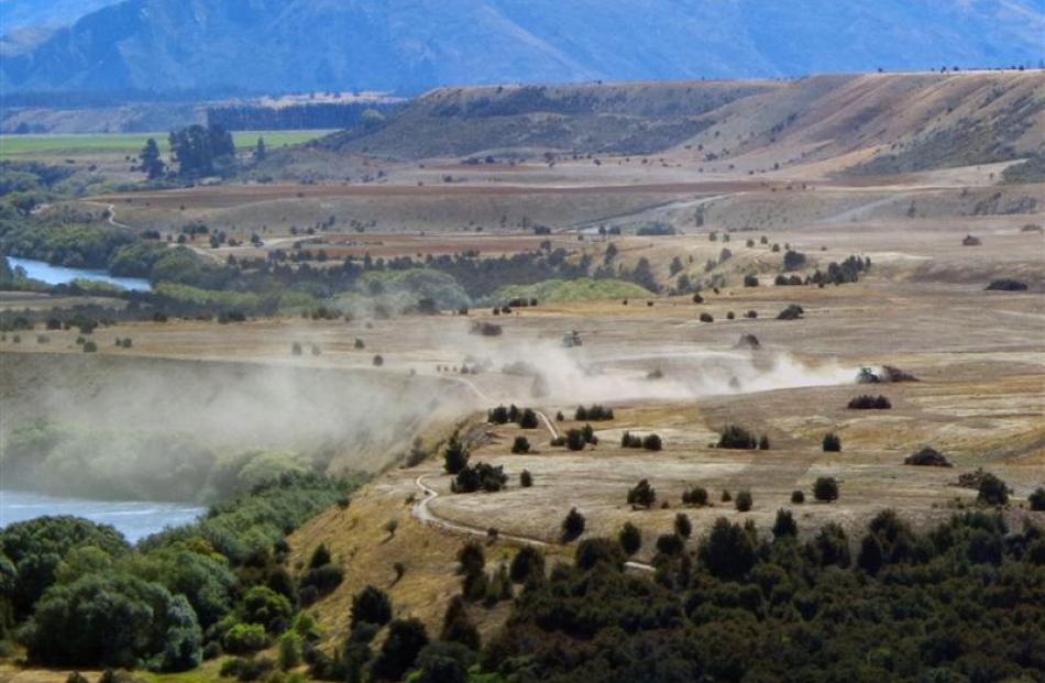 A tractor works land last month  at south Hawea Flat which is within an area surveyed in the mid...