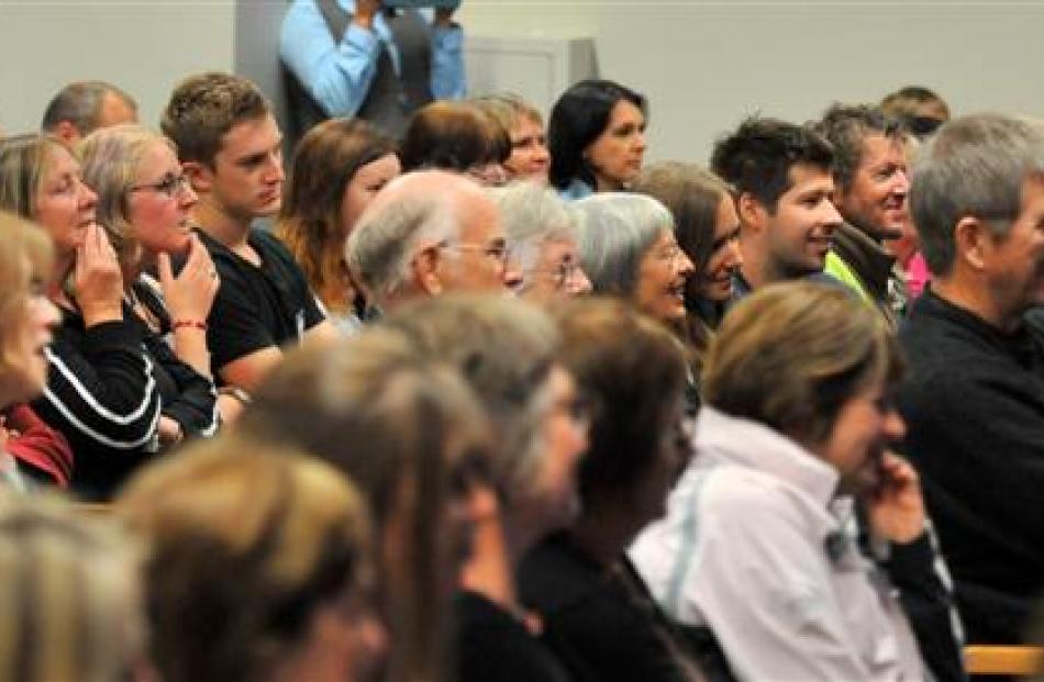The audience watches.