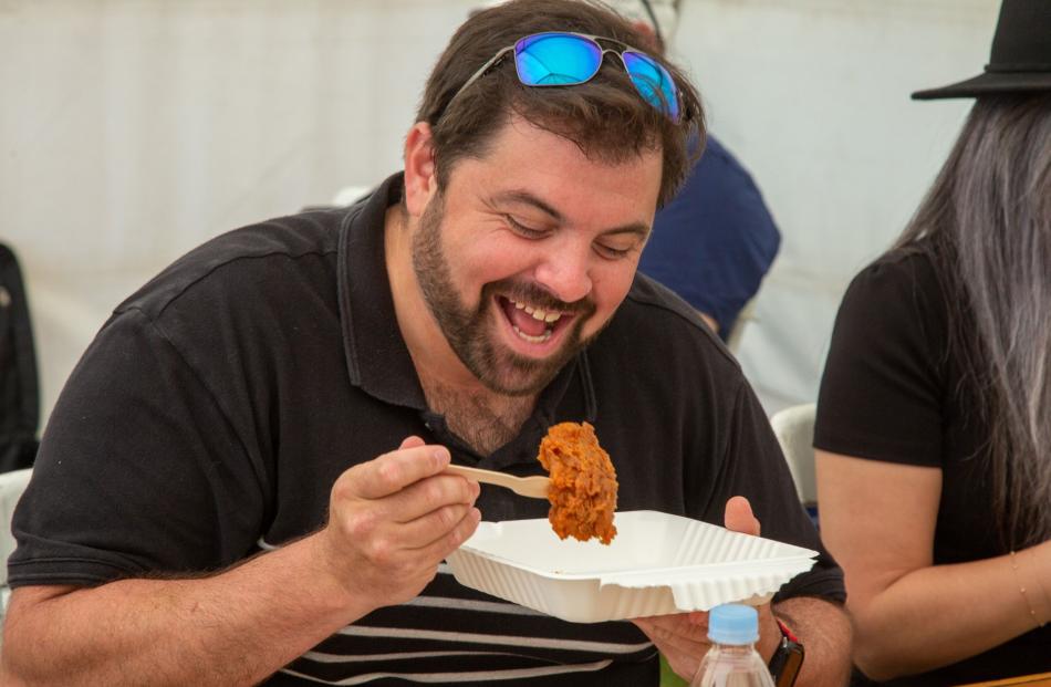 One of the 36 judges, Alexandros Andronikos (left) enjoys his work with a butter-based deep-fried...