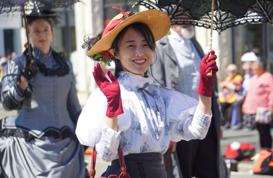 Walking in the Grand Street Parade is Fiorella Leaw, of Malaysia. PHOTOS: ARROW KOEHLER
