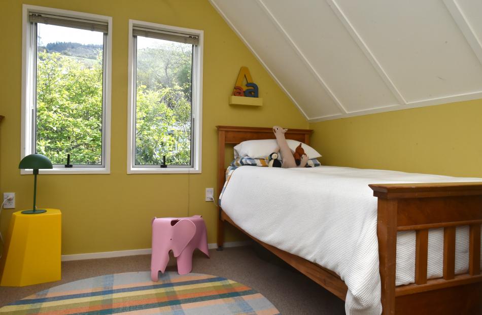 The bed in Alwyn’s room belonged to her grandfather when he was a child. The mustard colour on...
