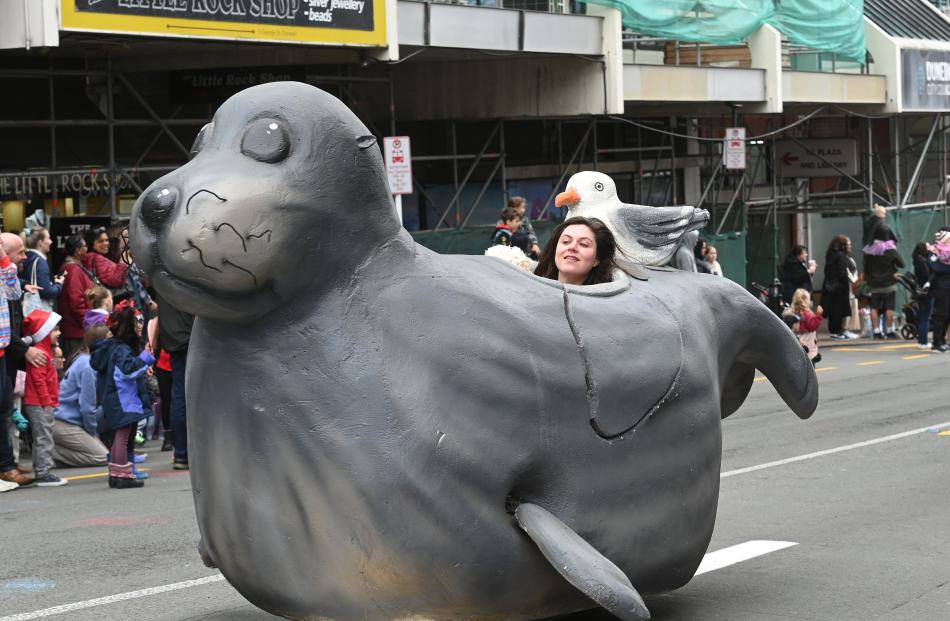 A seal and its winged friend roll along in the parade.