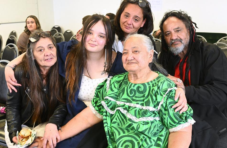 Graduate Taniya McBride (18, second from left) with grandmother Shirlene Tahiri, mother Ashley...