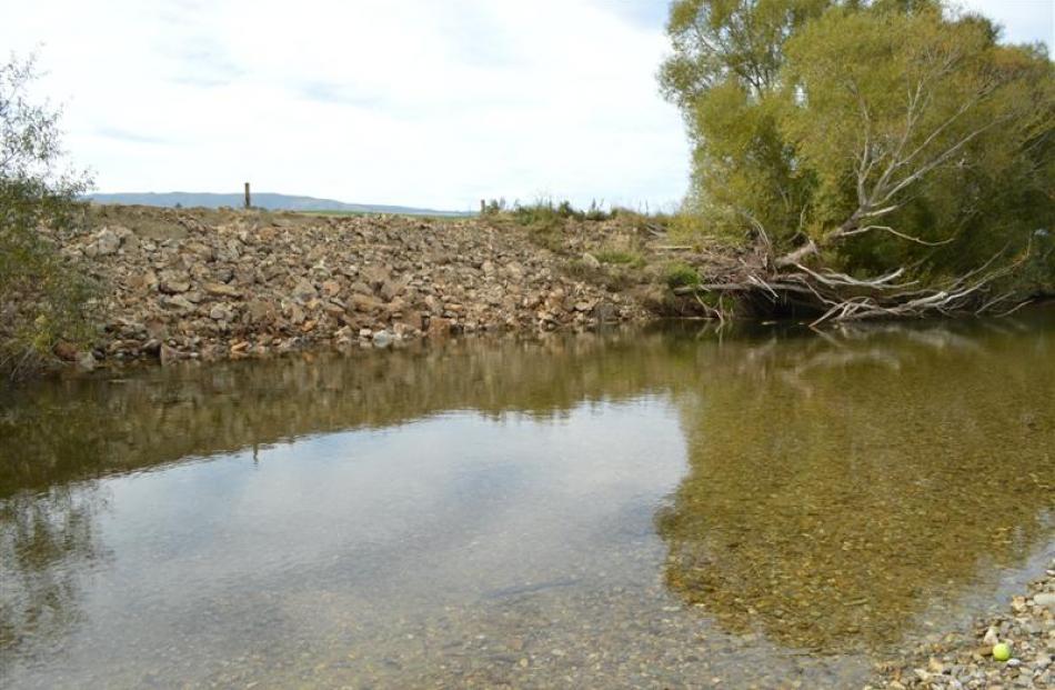 Farmers have taken to reinforcing banks with rock to protect against erosion along the Pomahaka...