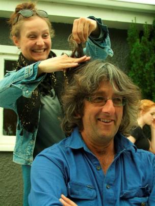 James Adam (above, left) prepares to lose his locks  after five years of hairy rebellion, helped...