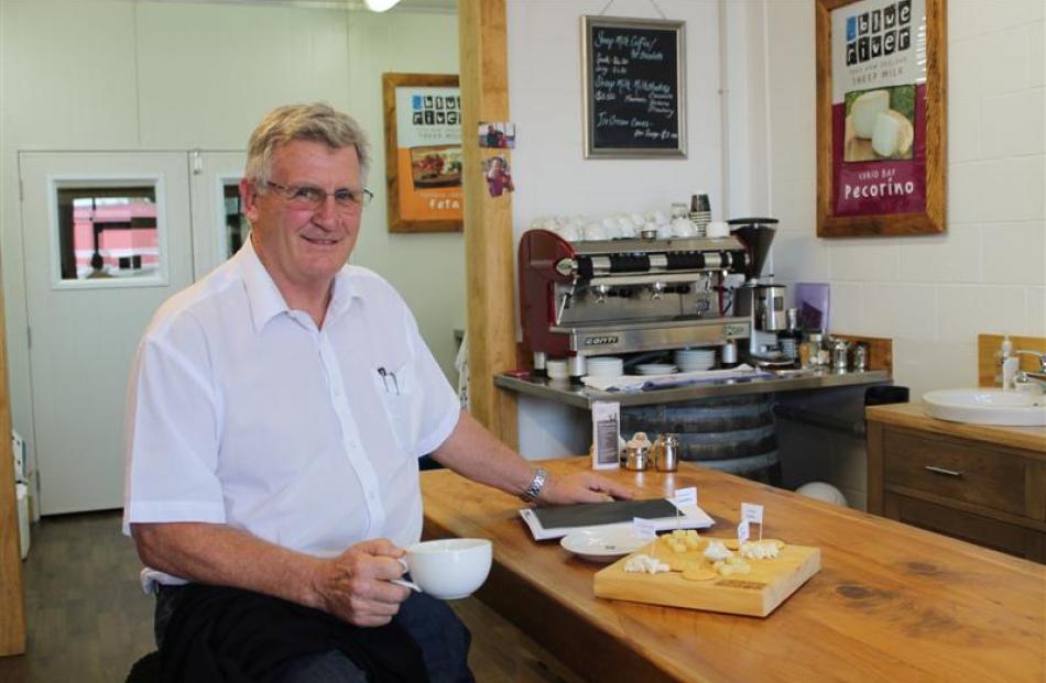 Blue River Dairy founder Keith Neylon enjoys coffee in the tasting room, shop and cafe at the...
