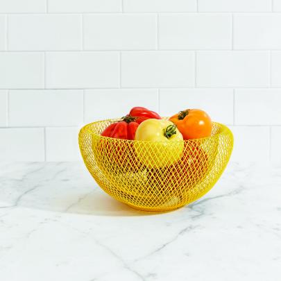MoMA double walled wire mesh bowl. Available in yellow, red or blue. $110 each.