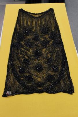 A black glass beaded dress from the Dunedin Art Gallery's collection.