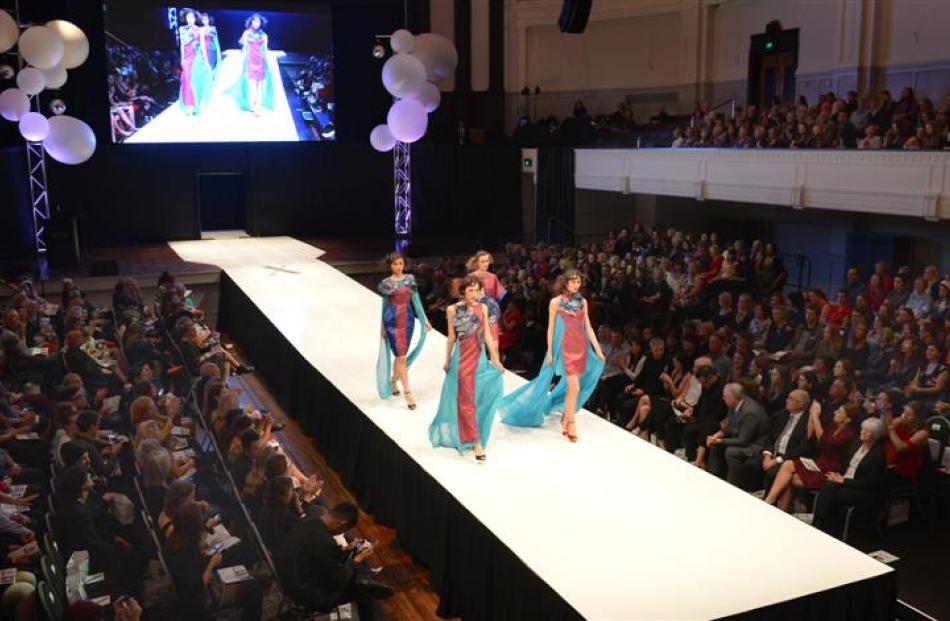 Models walk the collection ''Fan'', by Chinese designer Mingcheng Zhu, down the runway to a...