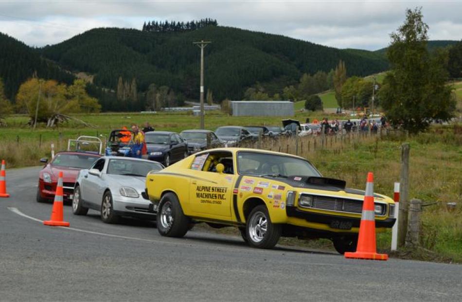 Drivers line up their cars at the Lawrence quarter-mile yesterday.  Photos by Helena de Reus.