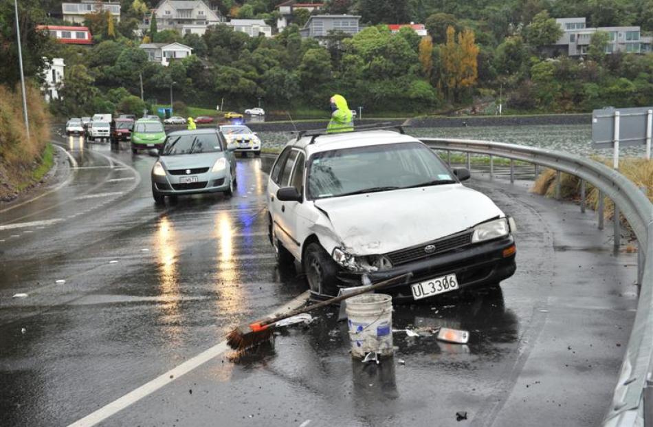 A Toyota Corolla station wagon and Nissan Bluebird crashed in Portobello Rd, near Doon St, about...
