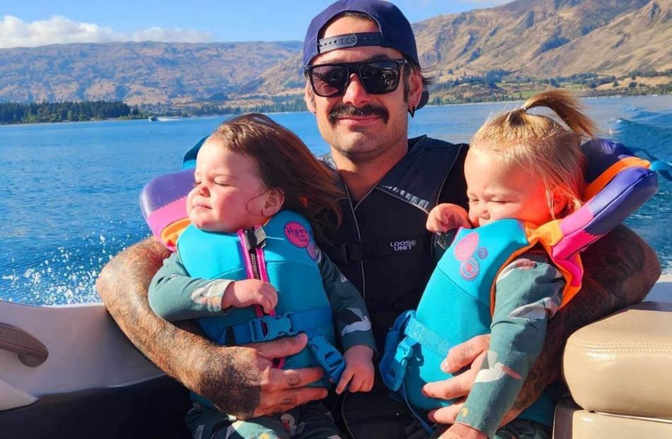 Wānaka fun ... Scotty Olsen, of Dunedin, holds twins River (left) and Charlee, 20 months. PHOTO:...