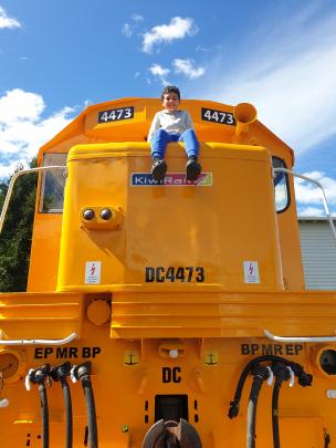 Training day . . . Benjamin Hodson, 11, on a locomotive hood on a nice sunny day at the Crazy...