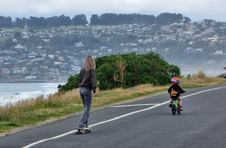 Wait for mum ... Sherie Bell and son Denver (4) ride along John Wilson Ocean Dr. PHOTO: MIKE BELL