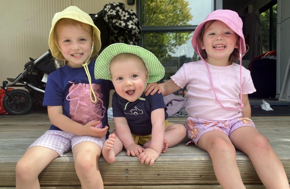 All smiles . . . Tily, 3, Tyson, 8 months, and Ivy, 2, Baas enjoy summer holidays in Alexandra on...