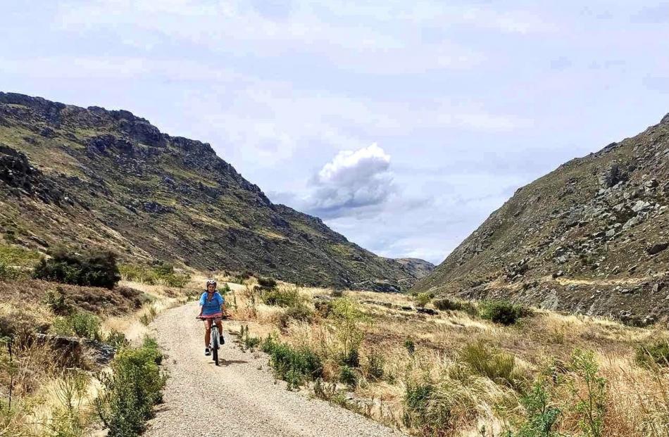 Riding along . . . Jess Courtney cycles the Roxburgh Gorge trail between Alexandra and Doctors...