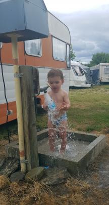 Water boy ... Rory Wilson, 18 months, enjoys playing with the tap water at the Alexandra Holiday...
