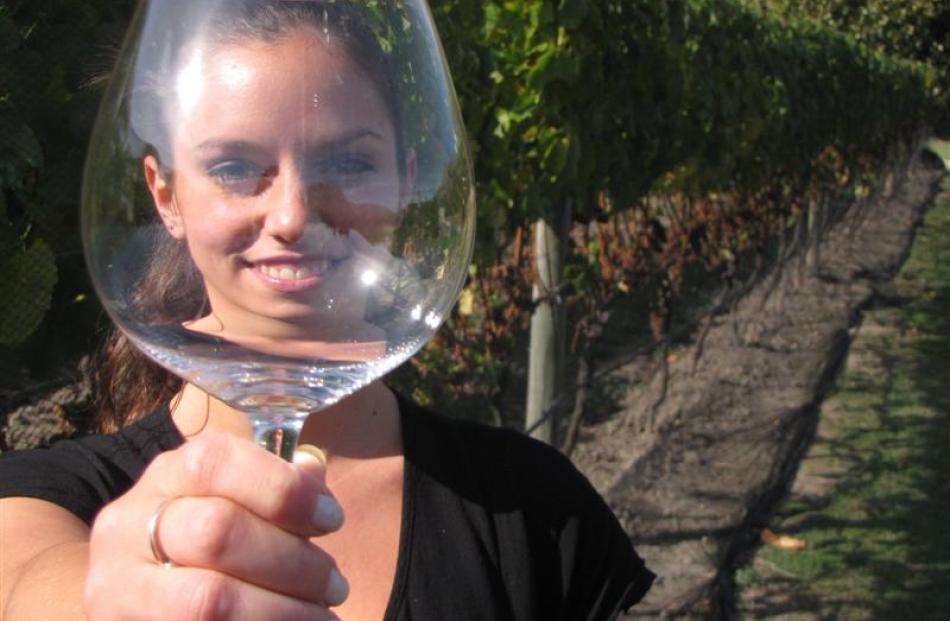Raising a glass at Amisfield yesterday is bistro waitress Natasha Hoarau.  The Lake Hayes winery...