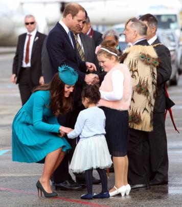 The royal couple are greeted on the tarmac at Dunedin Airport. Photo by Getty
