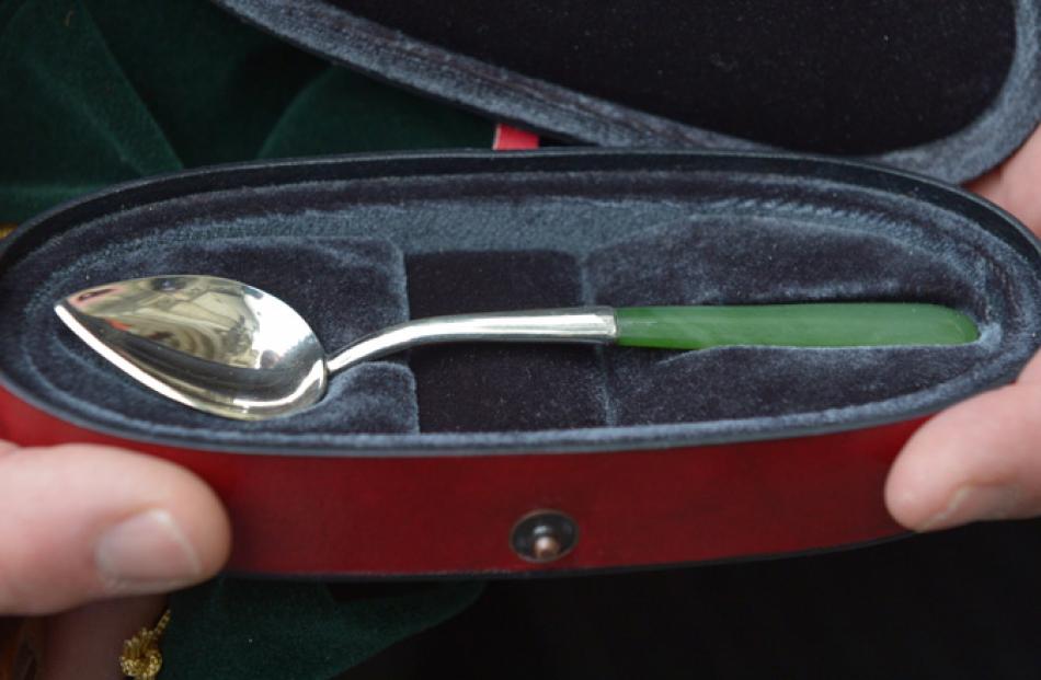 A silver spoon with pounamu handle crafted by Dunedin jeweller Tony Williams was presented to the...