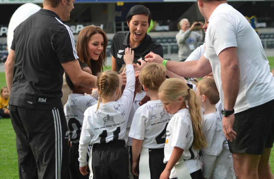 Catherine second from the left celebrates with the Pirates team.