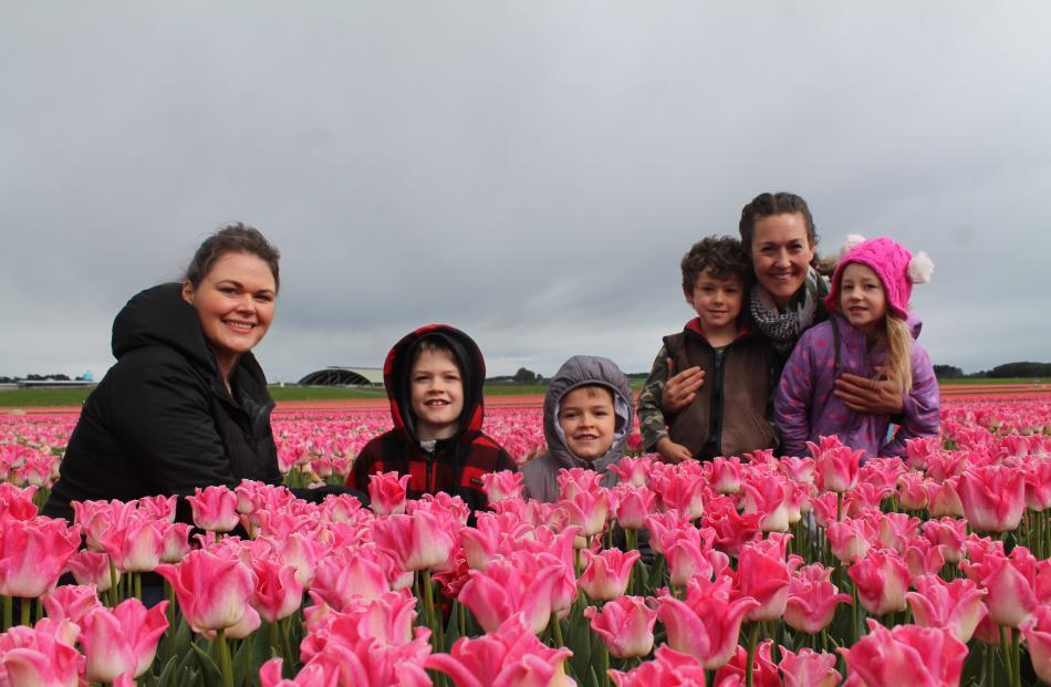 Families (from left) Amy, Harvey and Grayson Caldwell and Timothy, Eunice and Lidia Van Staden...